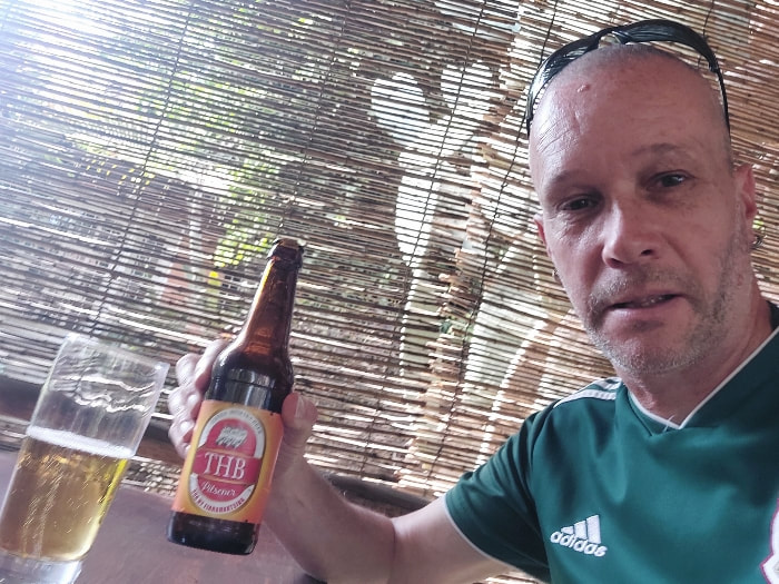 drinking a THB beer in Madagascar