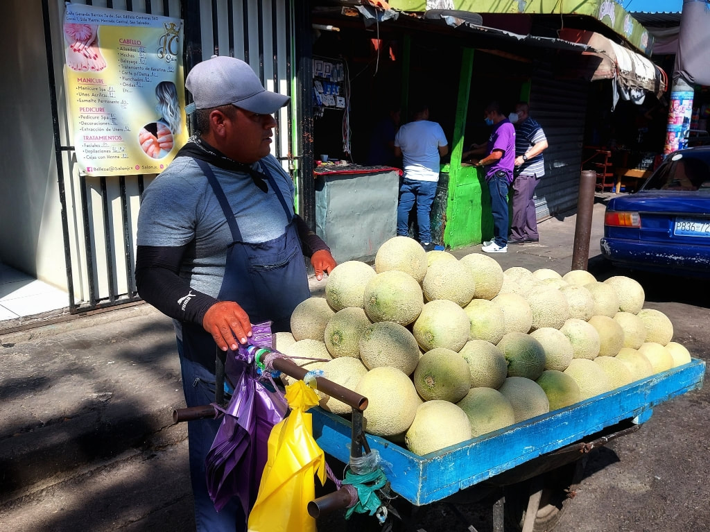 man selling melons in San Salvador