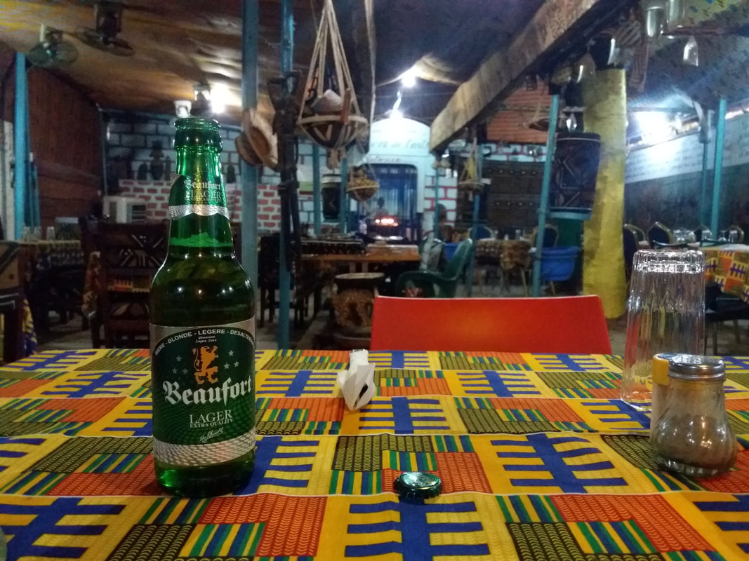 drinking a cold beer at the Resto Bafing in Bamako, Mali