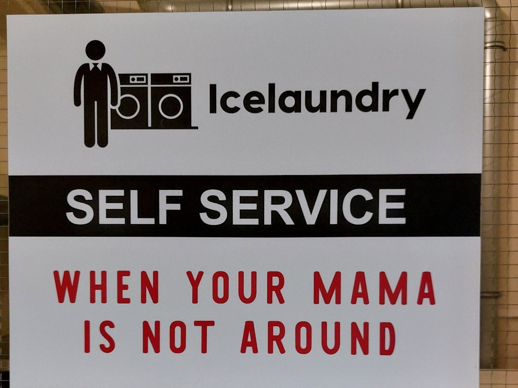 self-service laundry sign