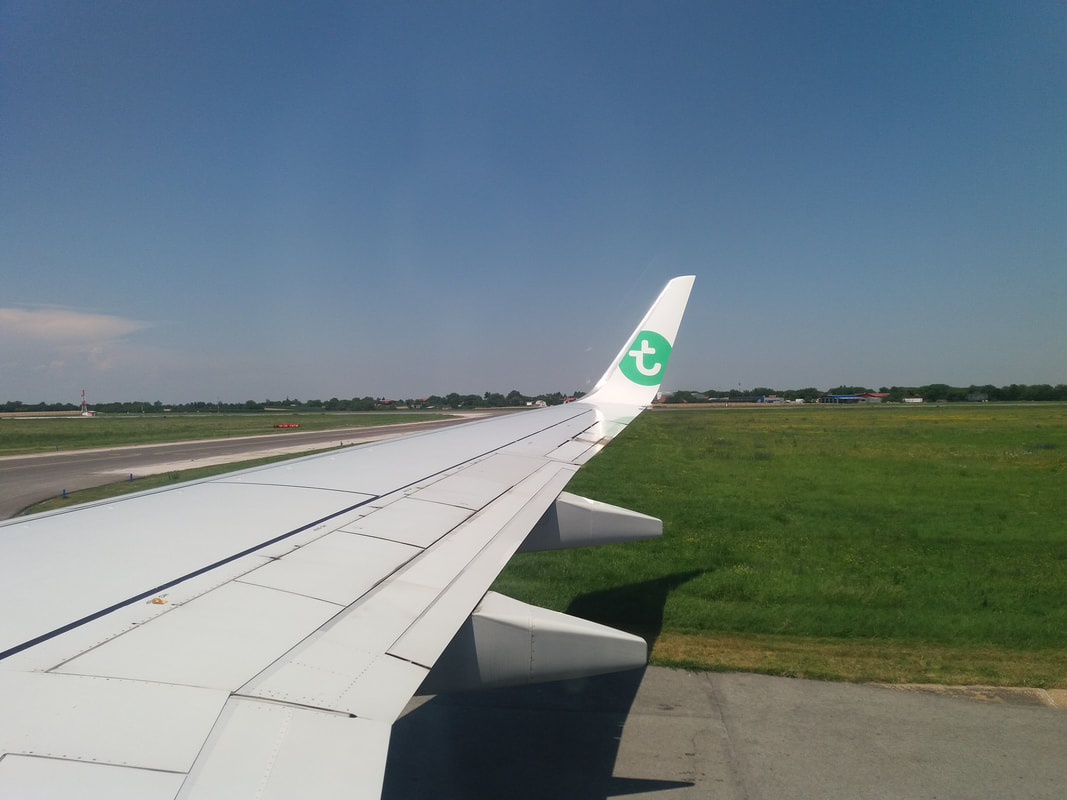 aircraft wing of the Transavia flight from Amsterdam to Belgrade