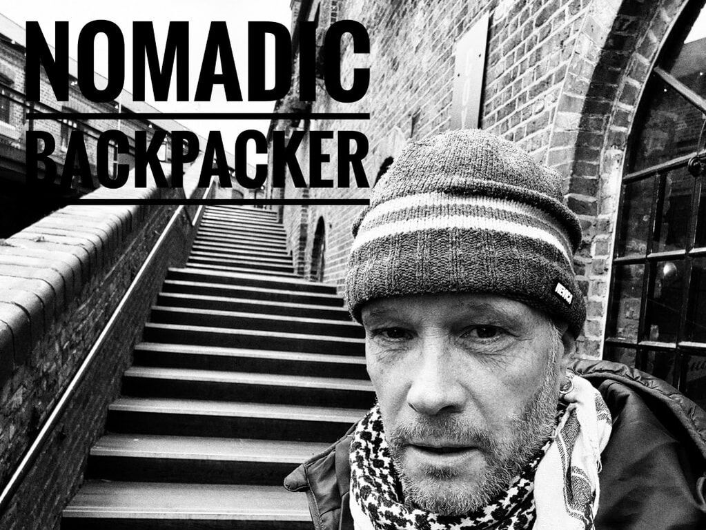 Nomadic backpacker in front of The Clash Steps in Camden, London