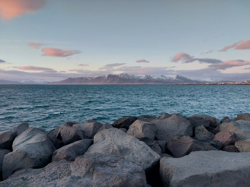 View across the water to the mountains on Reykjavik