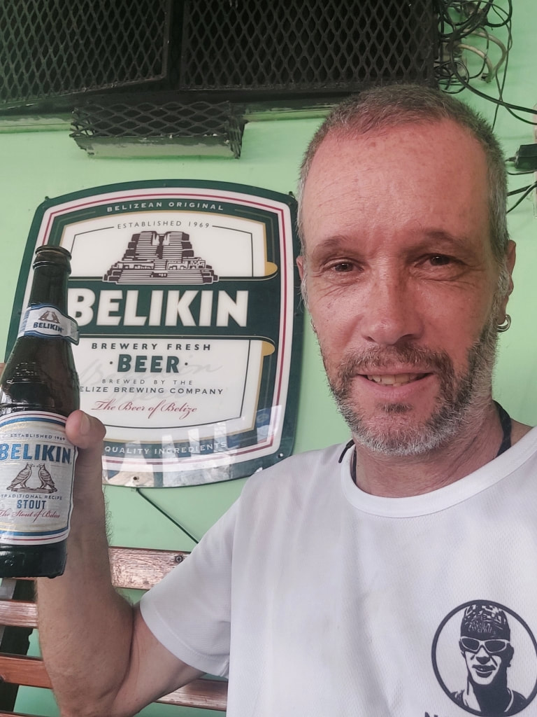 Nomadic Backpacker drinks Belikin Stout Belize