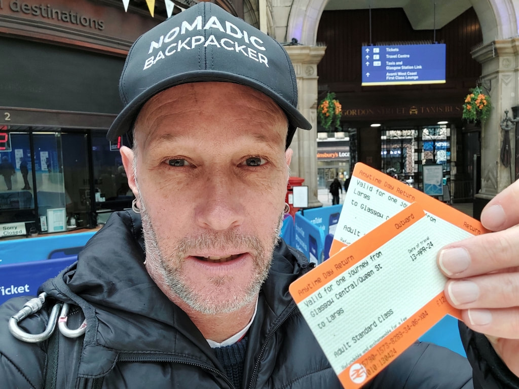 Nomadic backpacker with tickets to Largs at Glasgow Central