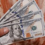 Changing Money on the Black Market in Burundi US Dollars fanned out