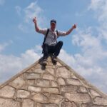 How to Visit the Southernmost Source of the Nile in Burundi Nomadic Backpacker on top of the Source du Nil Pyramid in Burundi