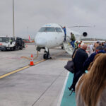 Iberia Flight Review: Madrid (MAD) to Nice (NCE) people boarding Iberia aircraft in Madrid