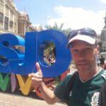 Self-Guided Nomadic Backpacker Walking Tour in San José (Costa Rica) SJO VIVE signs in San José