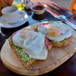 Best Cafes in Zipolite eggs with avocado on sourdough bread at the Cafeteria le Castelet in Zipolite